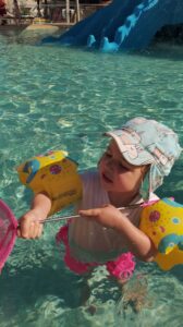 Ava playing in one of the pools at Kiani Beach Resort, Kalyves