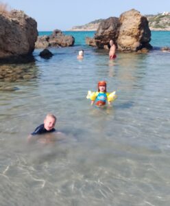 Arthur & Ava in the little rocky cove at the far beach in Almyrida