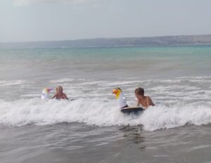 Ralph & Neve enjoying the waves at Almyrida Beach