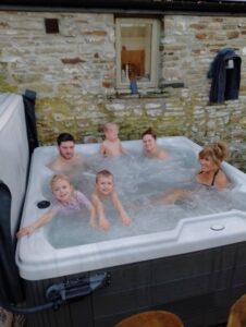 Enjoying the hot tub after our long Christmas Eve walk on the beach